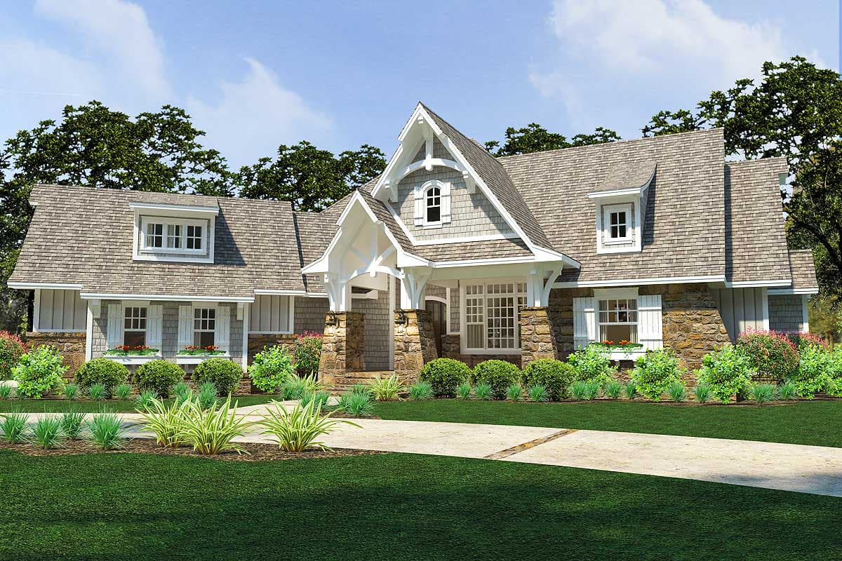 House plan exterior: Two-story home with stone accents, multiple gables, dormer windows, and a covered entry porch with stone pillars.