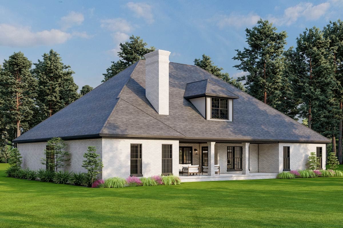 House plan exterior: White brick, hipped roof, prominent chimney, covered rear porch with columns, dormer window.