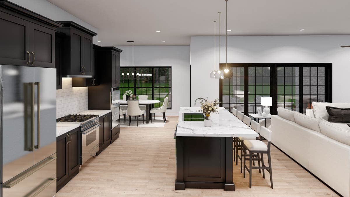 Open concept kitchen with dark cabinetry, marble island with seating, dining area, and adjacent great room.