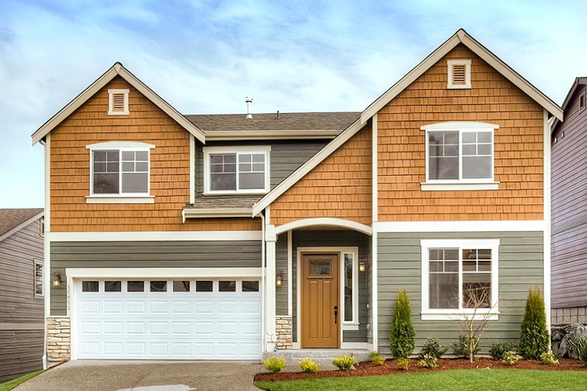House plan exterior. Two-story home with Craftsman-style elements. Features include shingle siding, gabled rooflines, and a front-facing garage.