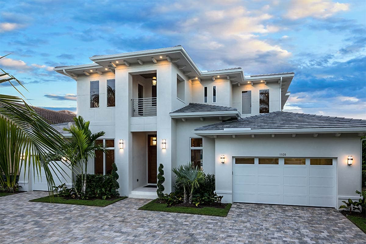 House plan exterior featuring a two-story modern style home with flat rooflines, a balcony, and a front-facing garage.