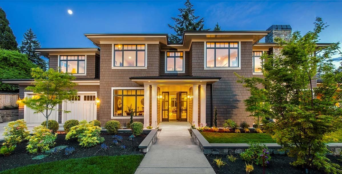House plan exterior with two stories, visible gables, a covered entryway, and a side-entry garage. Brown shingle siding.