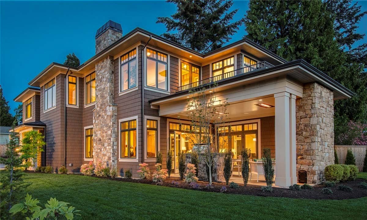 House plan exterior: Modern style, two stories, stone chimney, covered porch with columns, large windows, and horizontal siding.