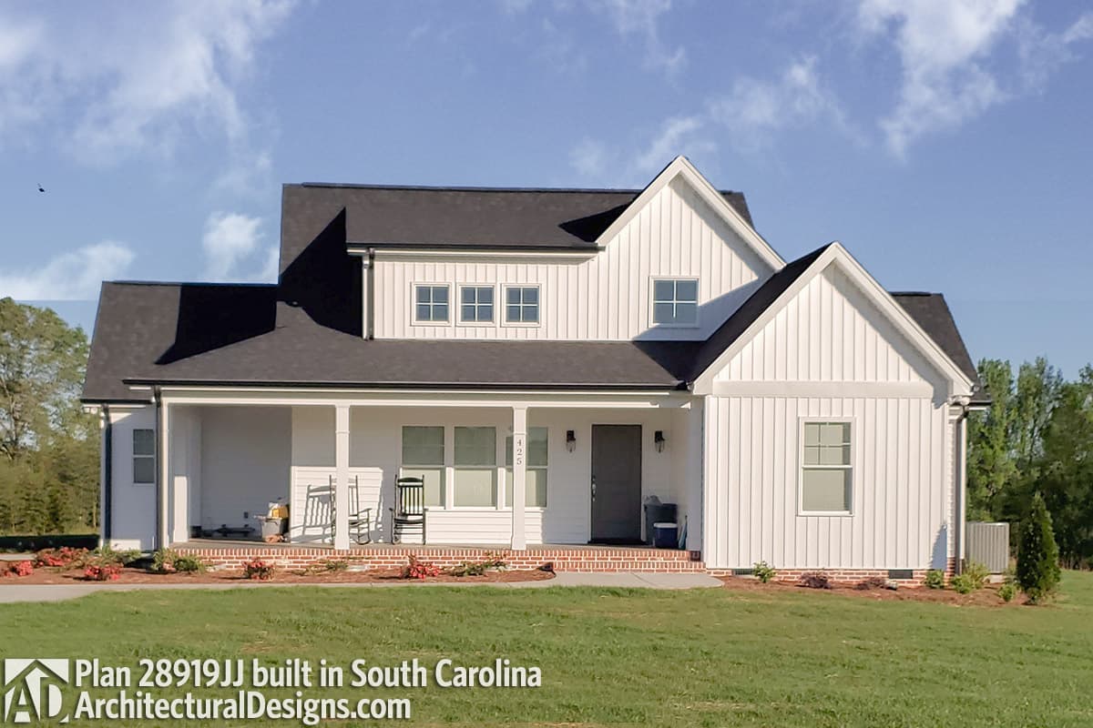 Modern Farmhouse house plan exterior with wrap-around porch, gabled dormers, and board-and-batten siding.