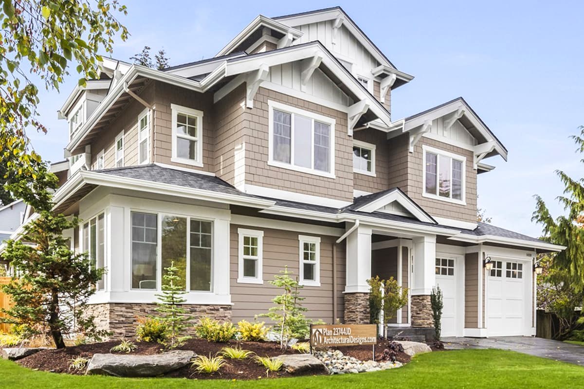 House plan exterior. Two-story Craftsman home with gabled rooflines, stone accents, and a front-facing garage. Includes a covered porch area.