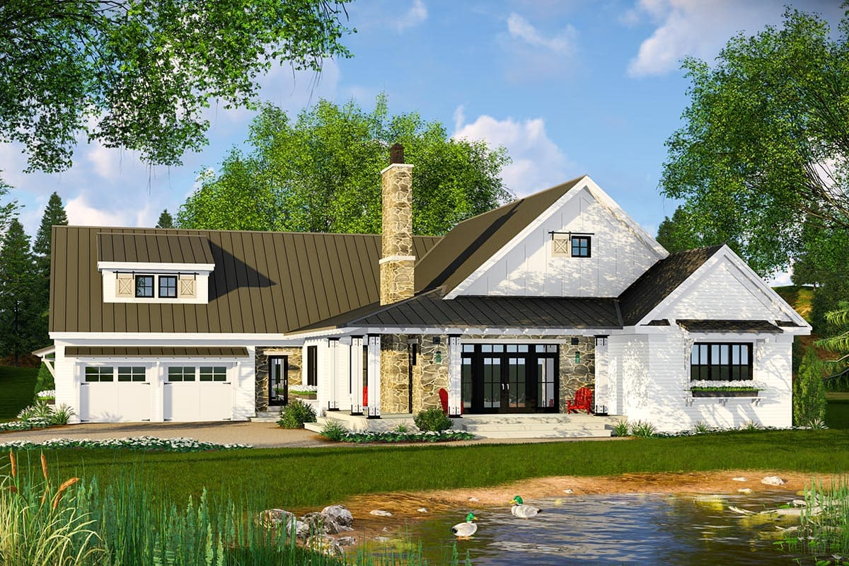 Modern Farmhouse house plan exterior with a metal roof, stone chimney, dormer, and a two-car garage.