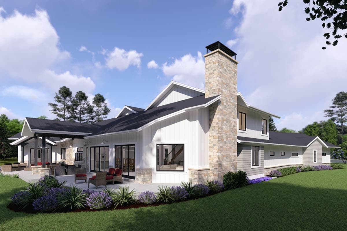 House plan exterior: Modern Farmhouse style with stone chimney, board and batten siding, gables, and covered patio.