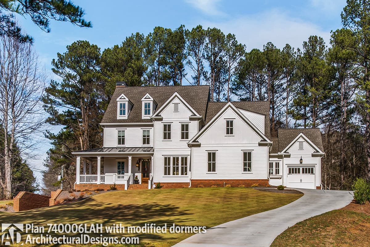 House plan exterior: Modern Farmhouse style, two stories, with a wraparound porch, multiple gables, and dormers.