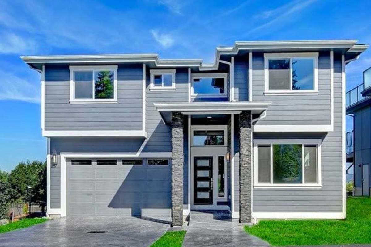 House plan exterior featuring a two-story modern design with horizontal siding, a covered entry, and a two-car garage.