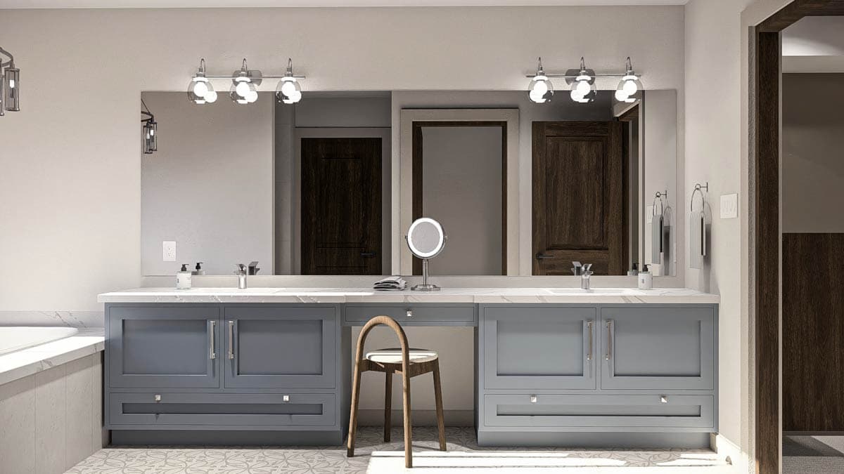 Bathroom vanity with double sinks, gray cabinetry, marble countertop, and wooden stool.