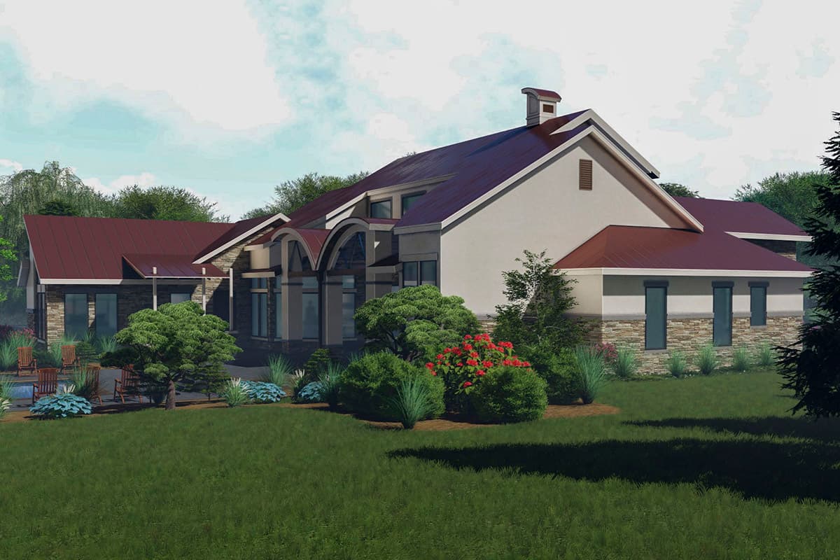 House plan exterior featuring a low-pitched roofline, stone accents, and arched windows.