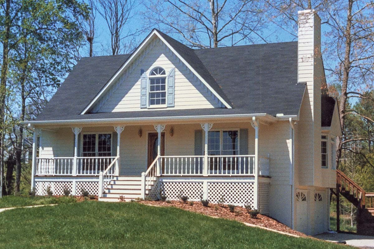 House plan exterior: Two-story Modern Farmhouse with wraparound porch, dormer window, and side garage access.