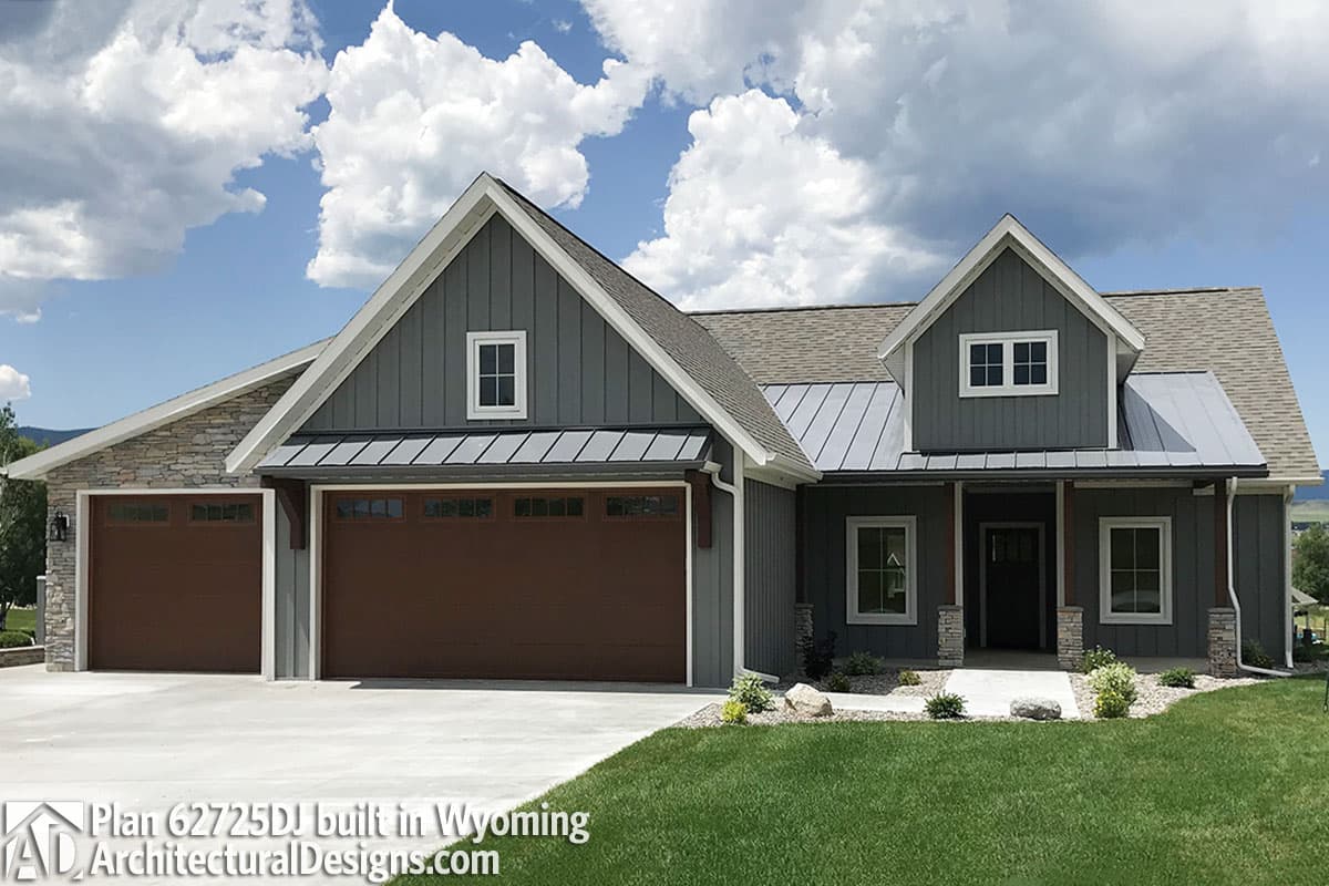 House plan exterior: Modern Farmhouse style, one story, with a three-car garage, board and batten siding, and metal roof.