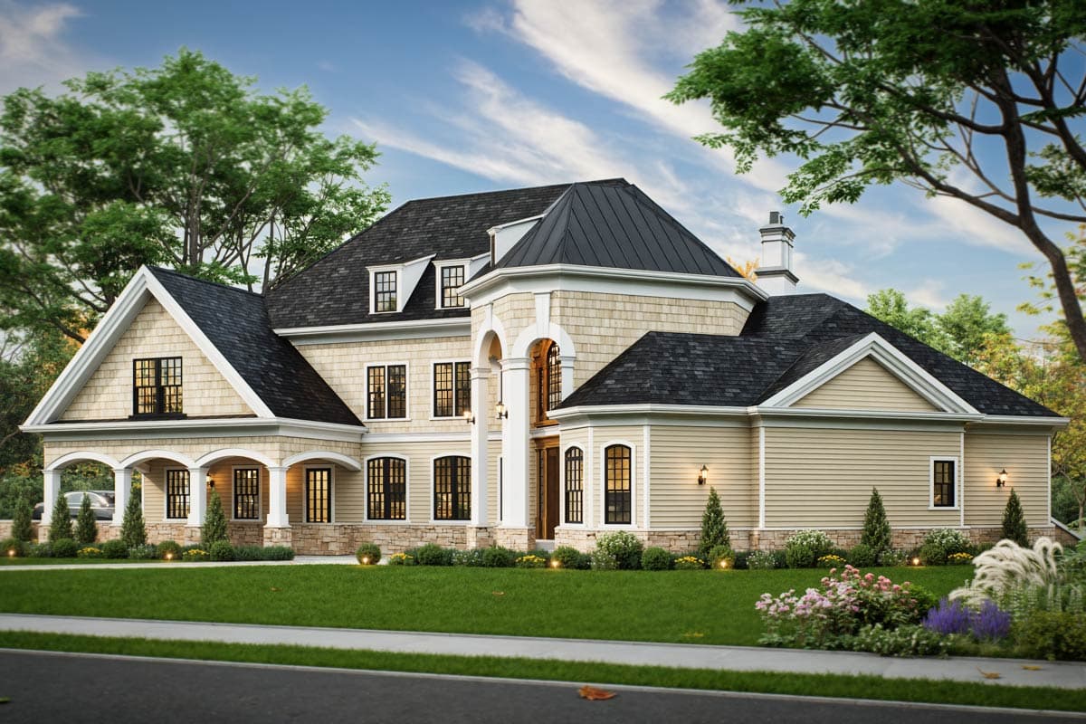 House plan exterior: Two-story Traditional style with stone accents, prominent turrets, a covered balcony, and multiple gables.