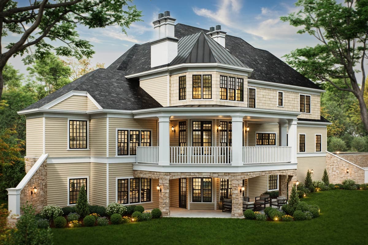 House plan exterior: Two-story home with wraparound porch, dormers, and stone-clad lower level.