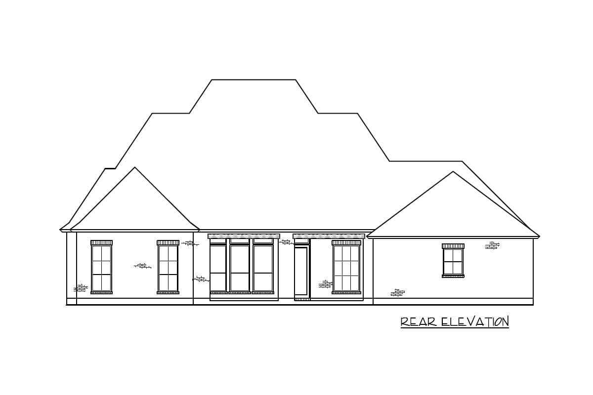 Rear elevation drawing of a house plan with a complex roofline, multiple windows, and brick detailing.