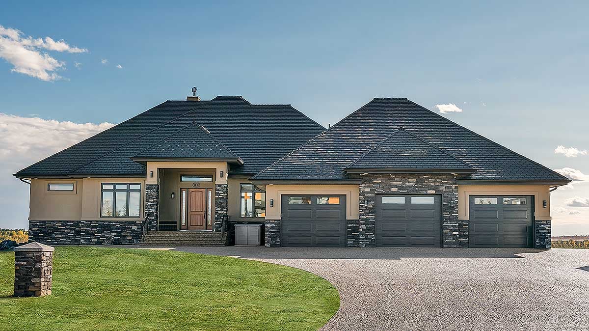 House plan exterior with two stories, stone accents, and a low-pitched roof. Features include a three-car garage and a covered entry.