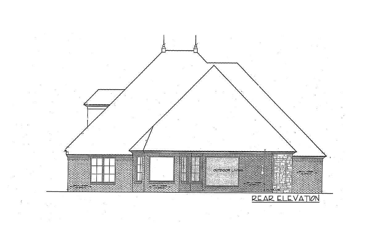 Rear elevation drawing of house with brick and stone facade, multiple gables, and large roof.