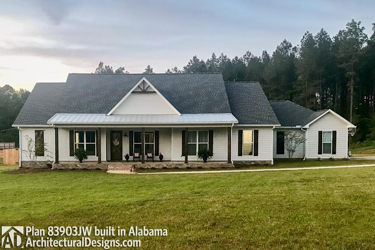 House plan exterior: Single-story Modern Farmhouse with a covered front porch, gabled dormers, and a metal roof overhang.