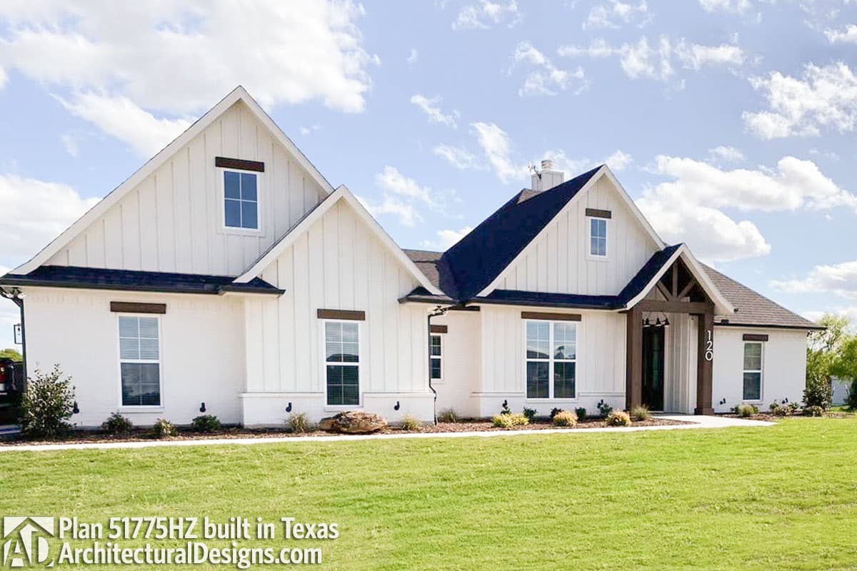 Modern Farmhouse house plan exterior with gables, board and batten siding, and exposed wood beams at entrance.