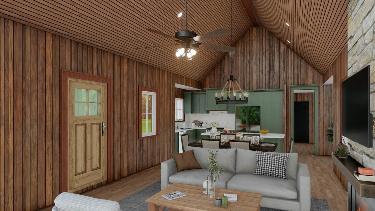 Interior view of a house plan showing a living room, dining area, and kitchen with vaulted wood ceilings, wood paneled walls, and a stone fireplace.