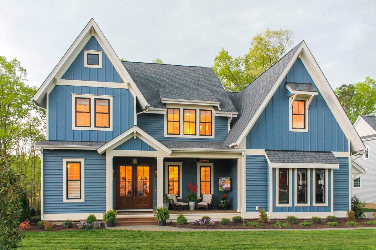 Modern Farmhouse style house plan exterior: two stories, gable dormers, front-facing gables, and covered porch with double door entry.