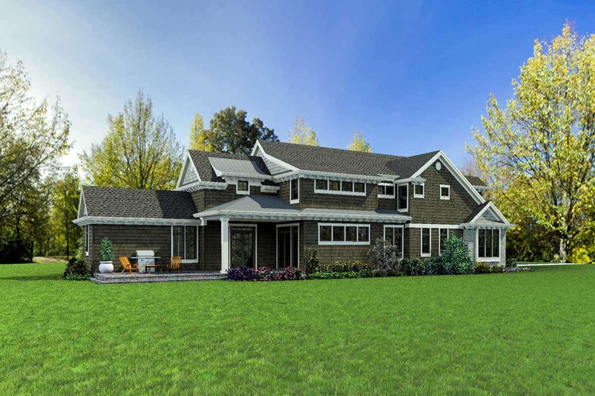 House plan exterior: Traditional style, two stories, with a covered porch, multiple gables, and wide windows.