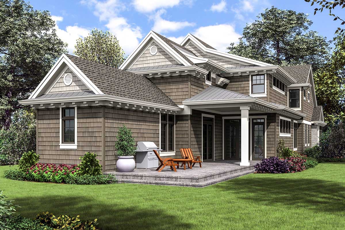 House plan exterior: Two-story home with cedar shake siding, multiple gables, dormers, and a covered porch with stone pillars.