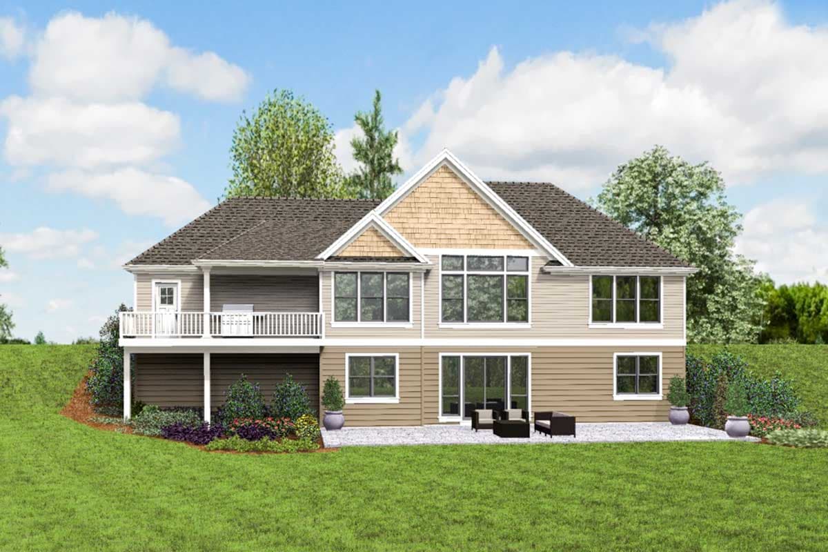 House plan exterior: Two-story home with deck, multiple gables, and large rear windows.