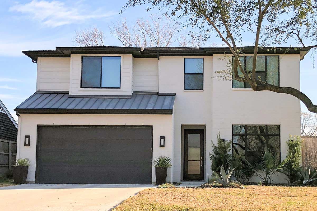Two-story modern house plan exterior with metal roof, horizontal siding, large windows, and a two-car garage.