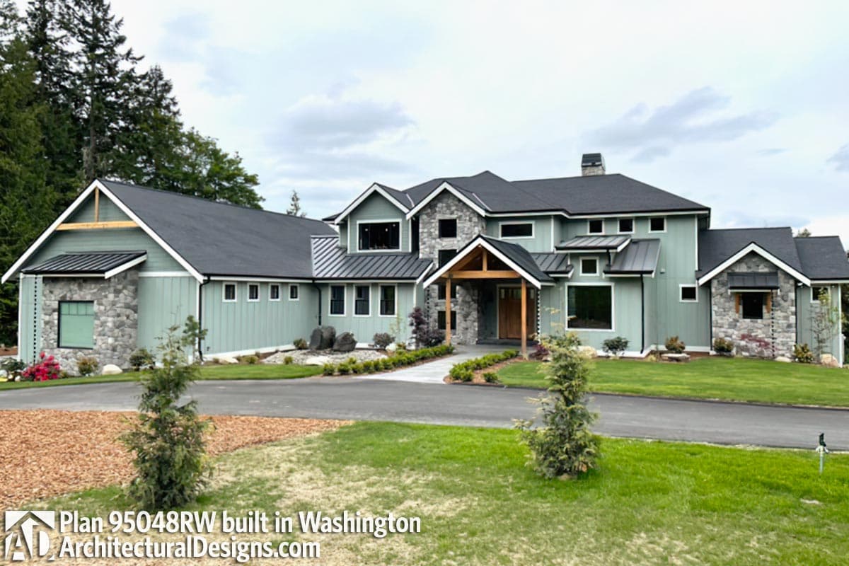 House plan exterior with prominent gables, stone accents, and a covered entry with wooden posts.