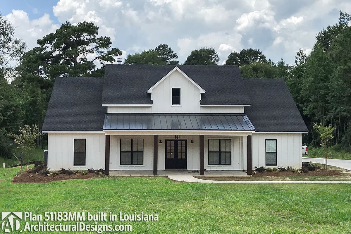 Modern Farmhouse style house plan exterior, one story, with covered front porch, metal roof, and board and batten siding.