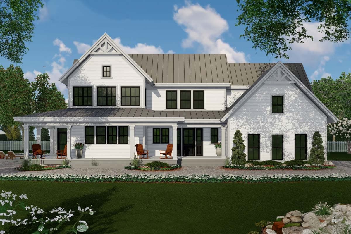 Modern Farmhouse house plan exterior with gabled dormers, a wraparound porch, and metal roof.
