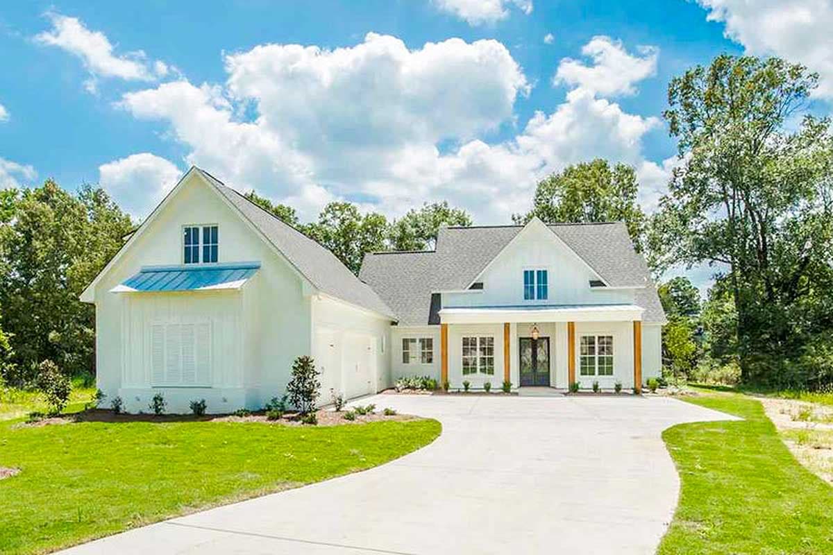 Modern Farmhouse house plan exterior with gables, prominent dormer with blue roof accent, and covered porch supported by wood columns.