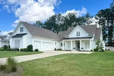 Modern Farmhouse Plan with Courtyard Garage and Bonus Above