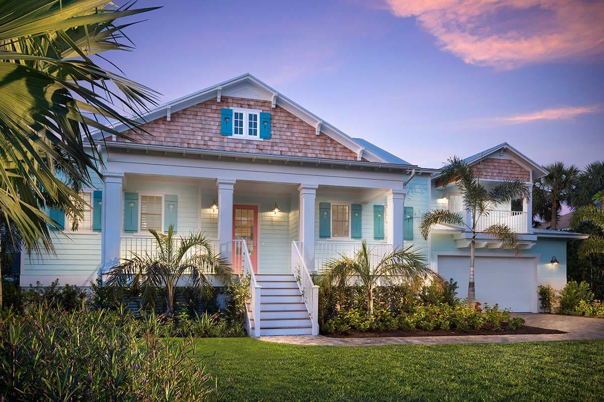 House plan exterior: Coastal style, two stories, covered porch with columns, cedar shingle gable, and attached garage.