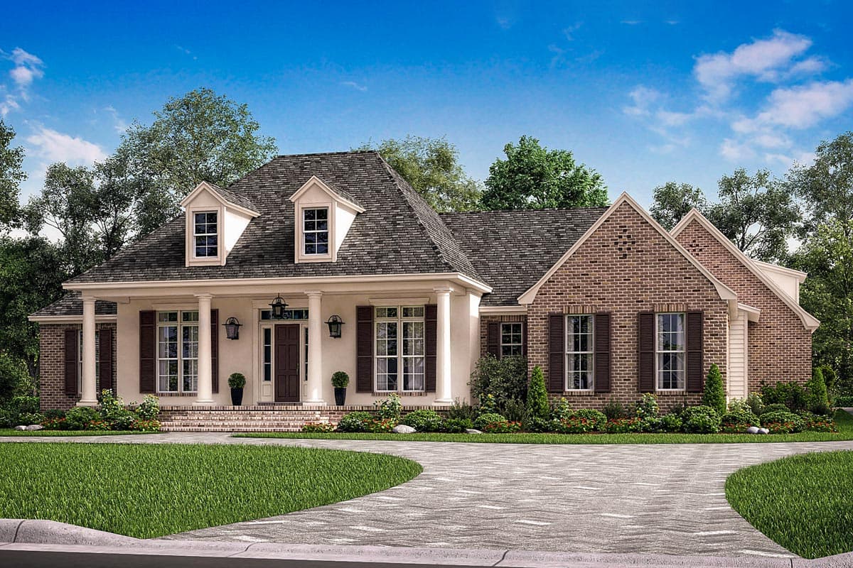 House plan exterior with two stories and dormers. Features include a front porch with columns, a brick facade, and a gabled roofline.