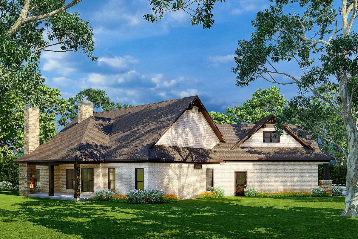 House plan exterior: One-story brick home with covered porch, stone chimney, and gable dormers.