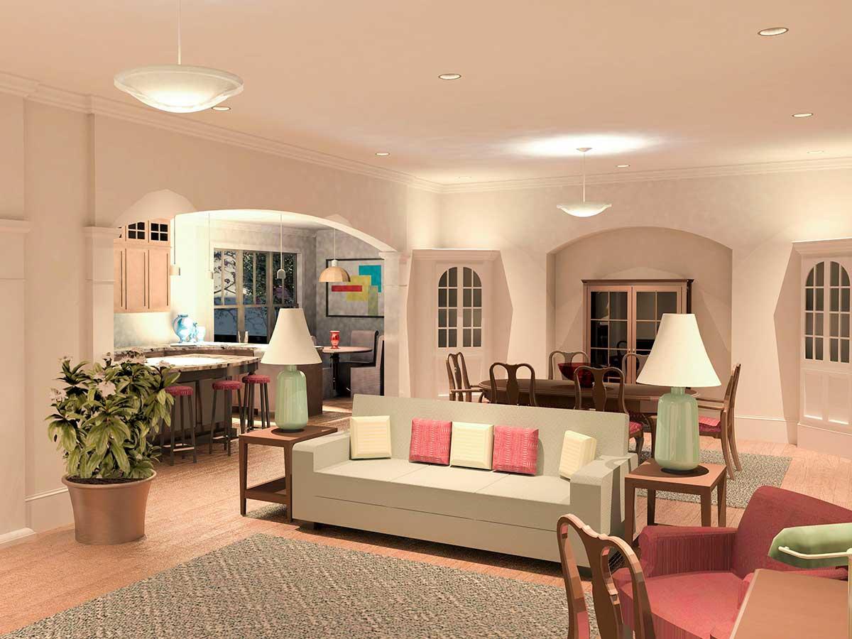 Open concept living area with kitchen island, dining table, and living room seating. Arched doorways.