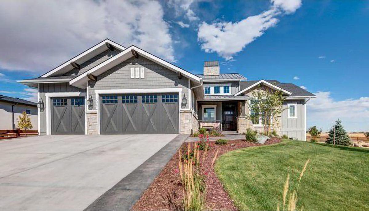 Modern Farmhouse house plan exterior with three-car garage, prominent gables, stone accents, and covered front porch.
