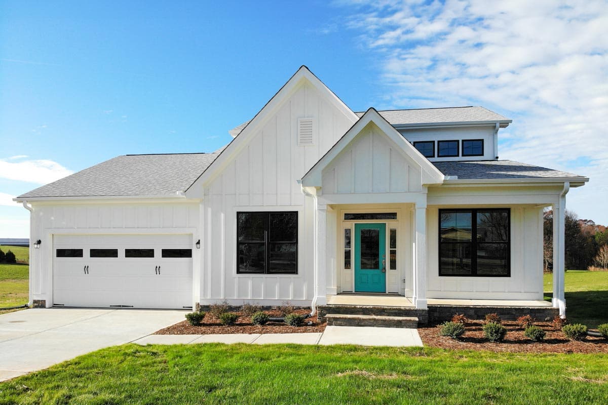 House plan exterior. Modern farmhouse style with gabled roof, covered porch, and attached garage. Two stories with board and batten siding.