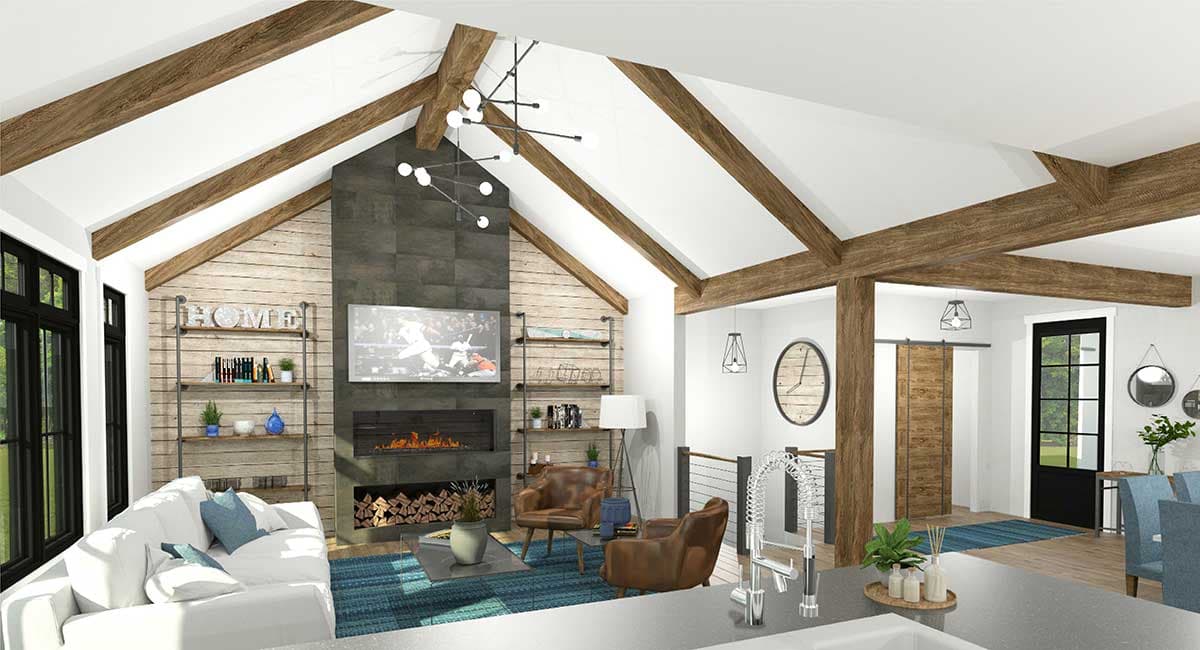 Great room with vaulted ceiling, exposed wood beams, stone fireplace, and shiplap accent wall.