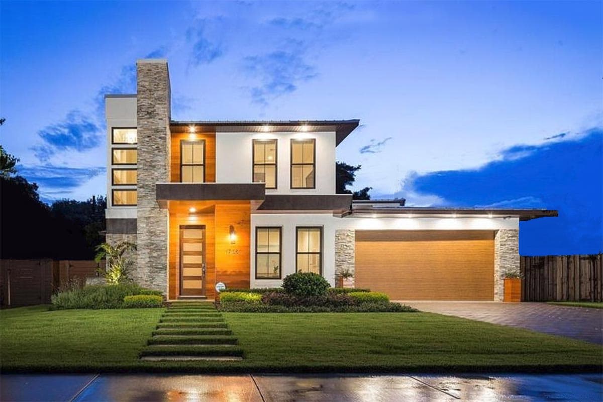 Modern two-story house plan exterior with stone chimney, wood facade, and attached garage.