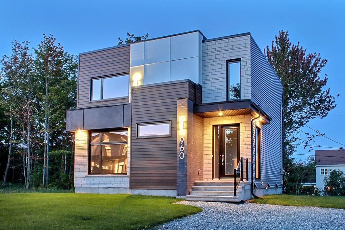 Modern two-story house plan with mixed materials, prominent entry, and large windows.