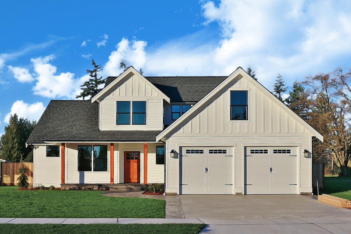 House plan exterior. Two-story Modern Farmhouse with gables, a covered porch, and a two-car garage. Features wood-tone door and porch posts.