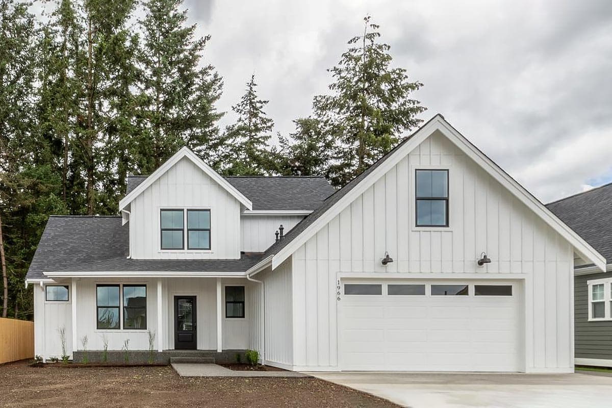 Modern Farmhouse house plan exterior with board and batten siding, gables, covered porch, and attached garage.