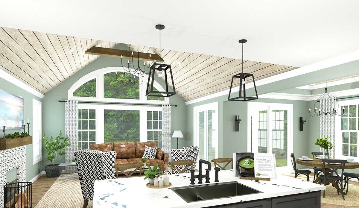Open-concept living space with vaulted wood-paneled ceiling, large arched window, fireplace, kitchen island, and dining area.