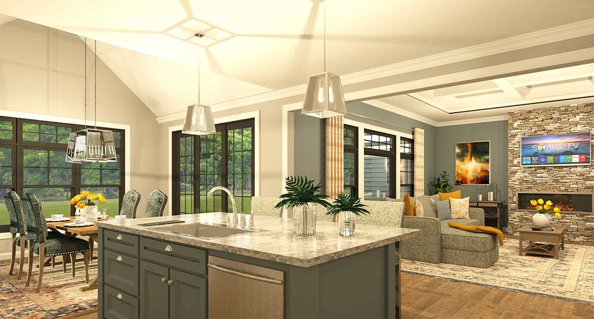 Open concept great room and kitchen with vaulted ceiling, stone fireplace, island with sink, and dining area.