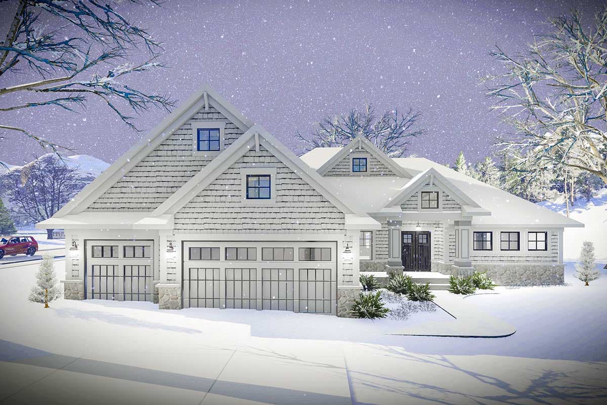 House plan exterior rendering. Features a Craftsman style with a three-car garage, multiple gables, and shake siding, covered in snow.