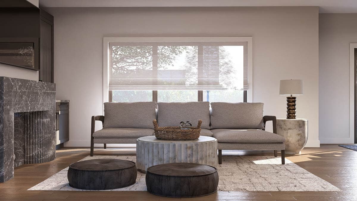 Living room with fluted stone fireplace, sofa, round coffee table, and large window with sheer Roman shades.